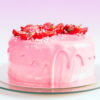 Pink Frosted Cake with strawberries